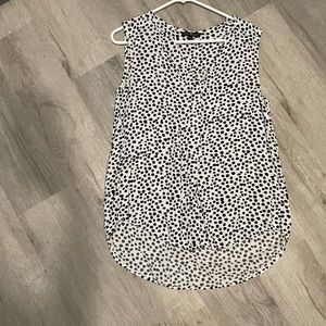 Black and white sleeveless blouse